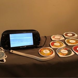 Sony PSP with charger, headset, and games